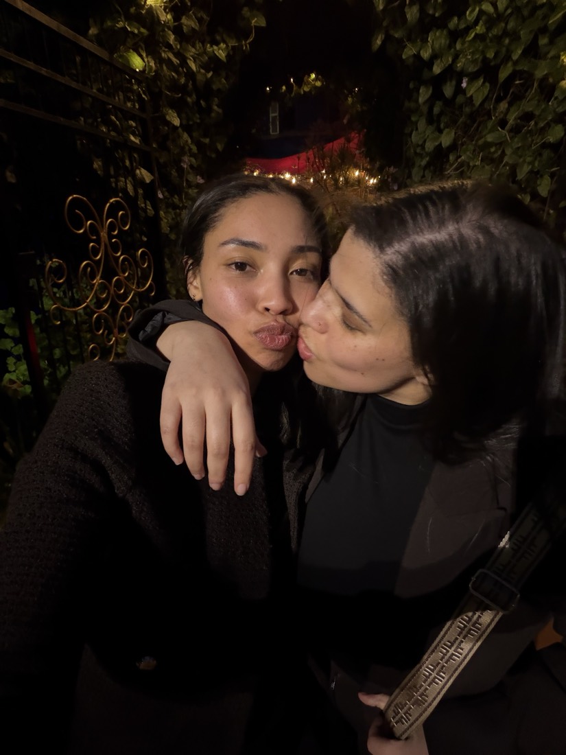 A kiss on the cheek under the ivy